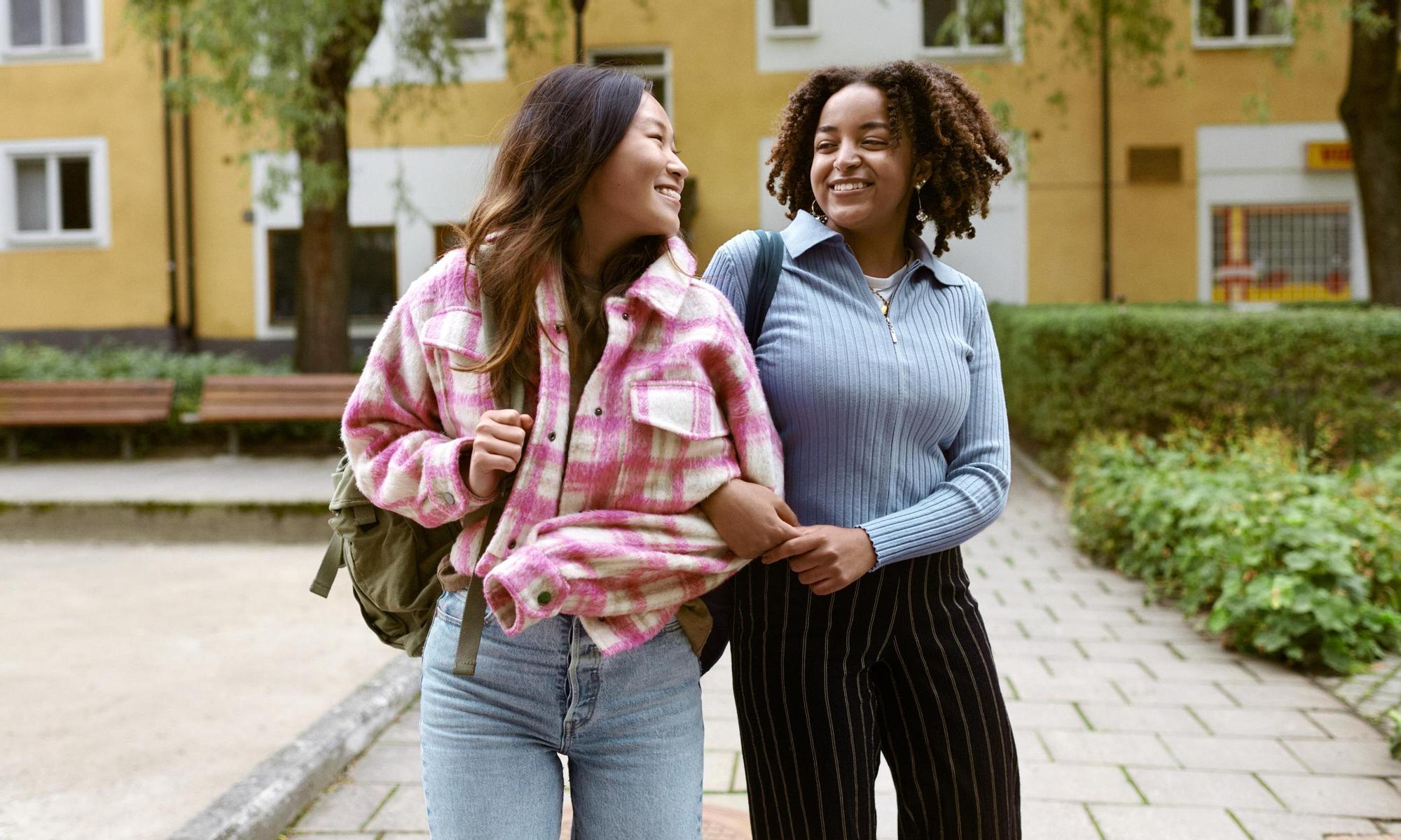 Two young women going to school