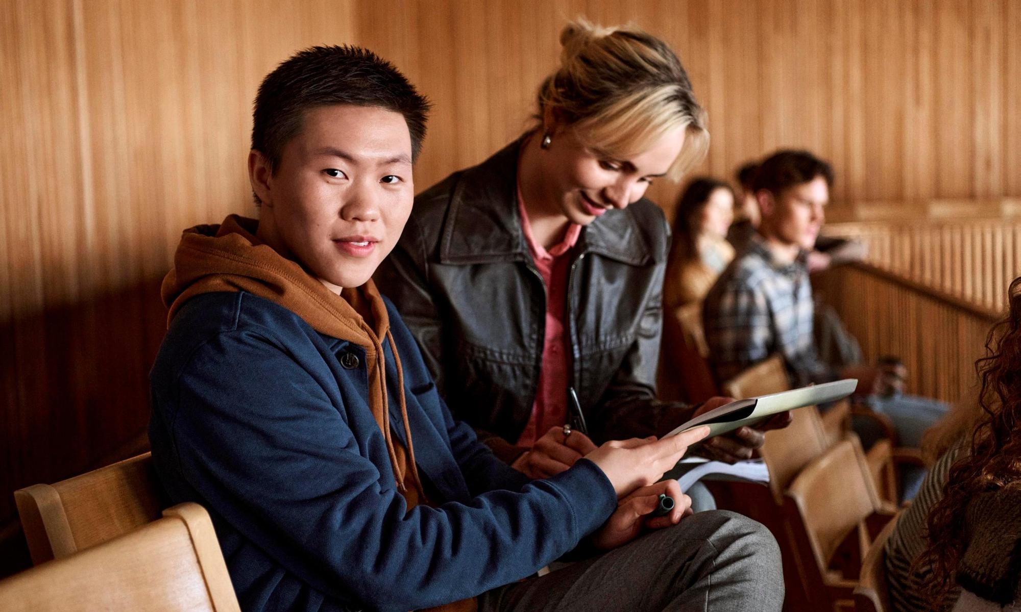 Group of students having a lecture in an auditorium