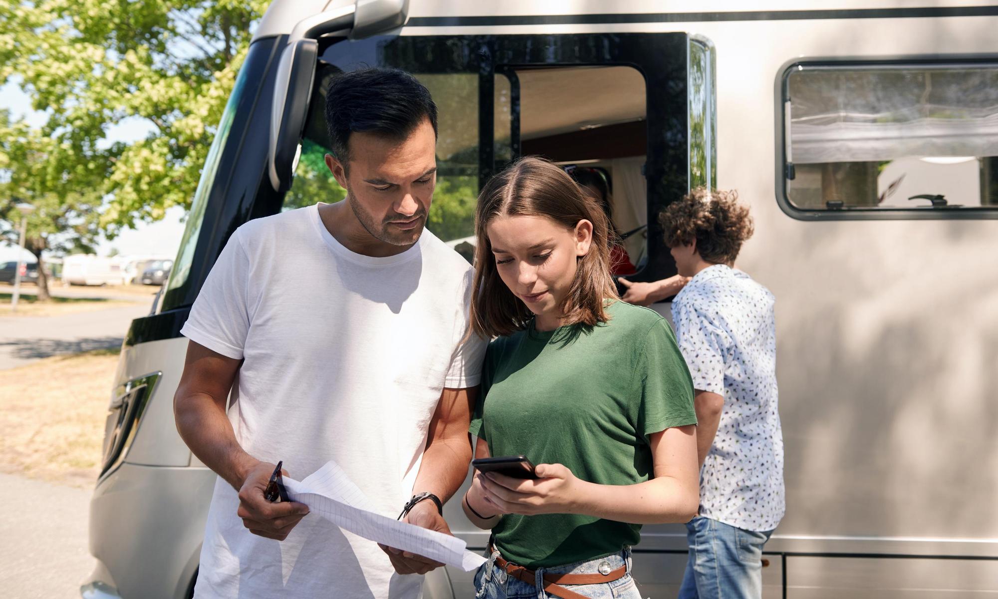 Couple in front of a camper van